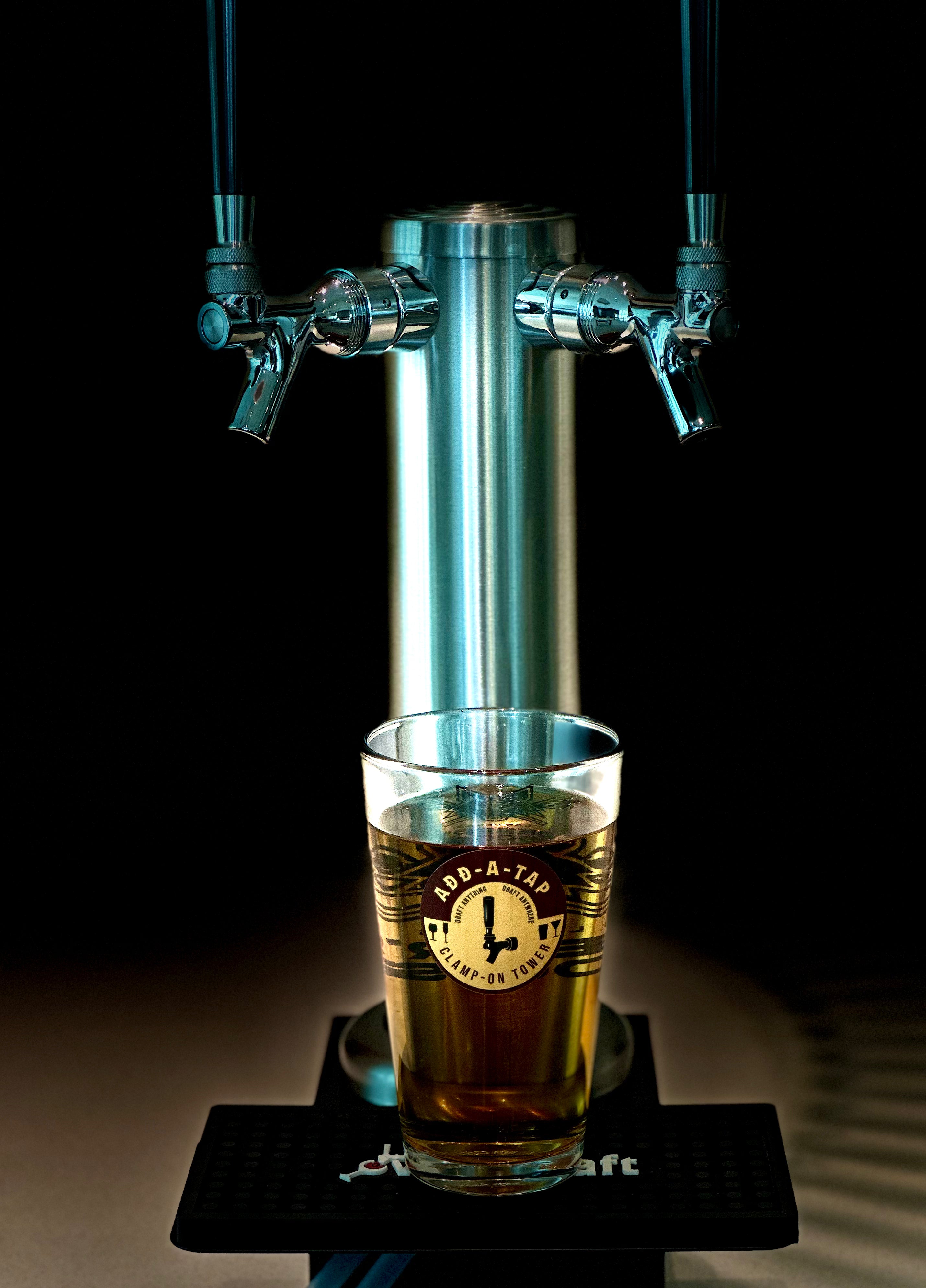 Double faucet clamp-on draft tower with draft beer glass shown; by Add-A-Tap